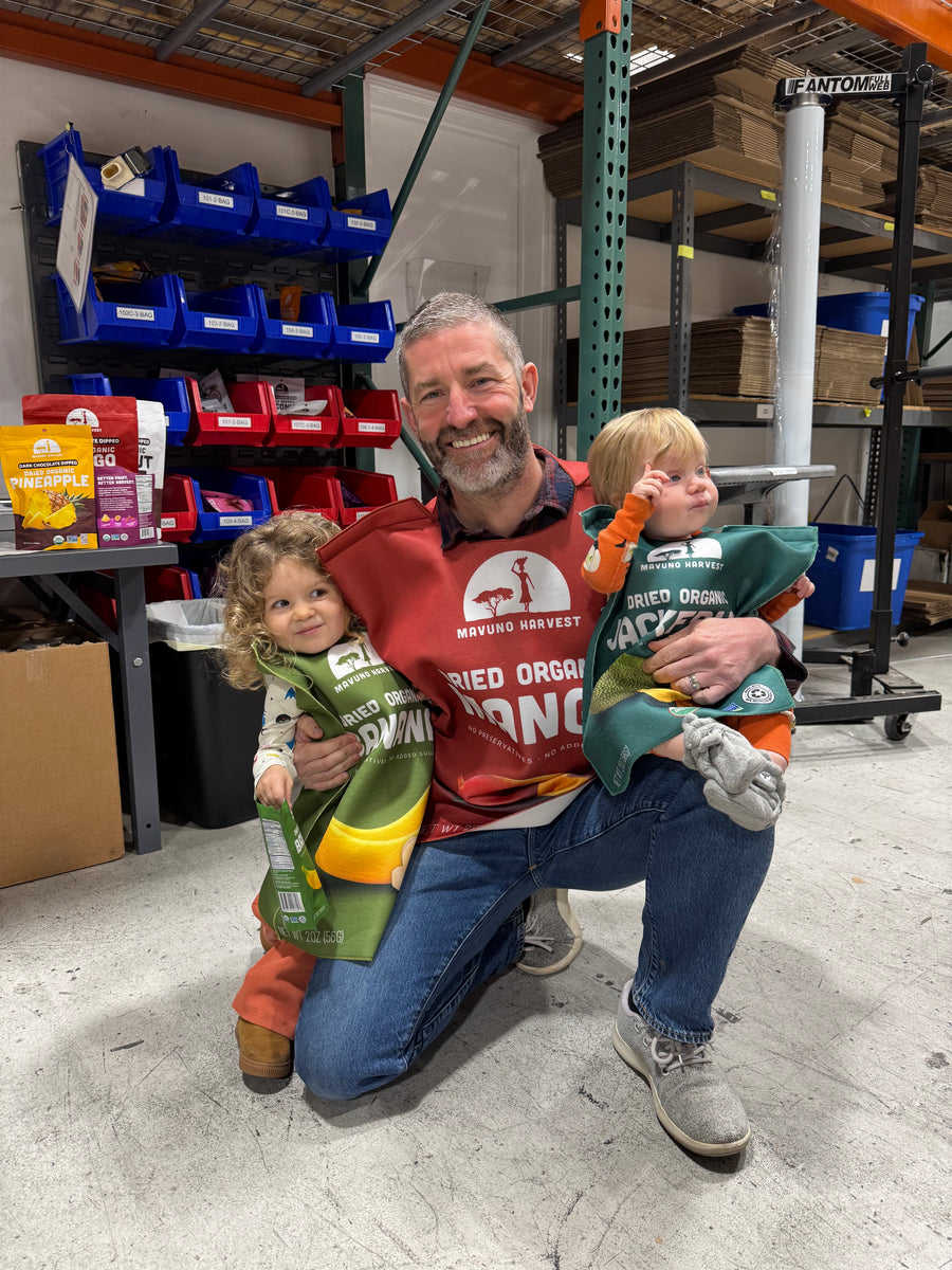 Mavuno founder Phil with his two daughters at the warehouse